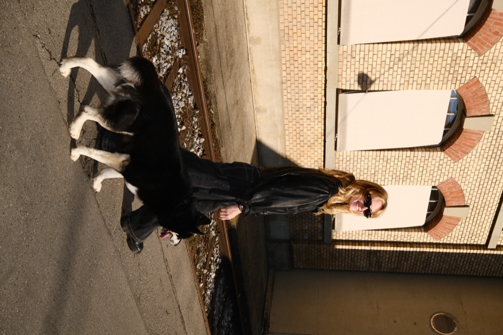 Christina with her dog looking out over the Hollywood hills
